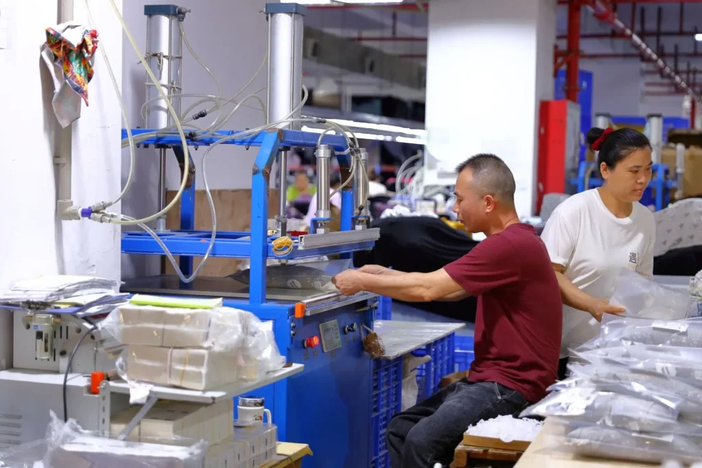 Premium custom t-shirt manufacturer highlighting combed cotton fabric texture, twin-needle collar topstitching, and discharge printing.